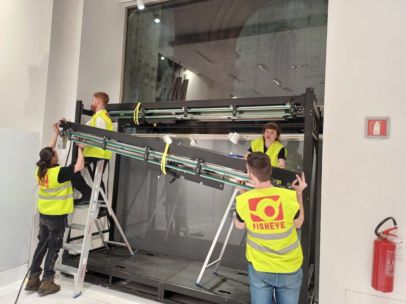 The Fisheye crew placing an installation in a shop window