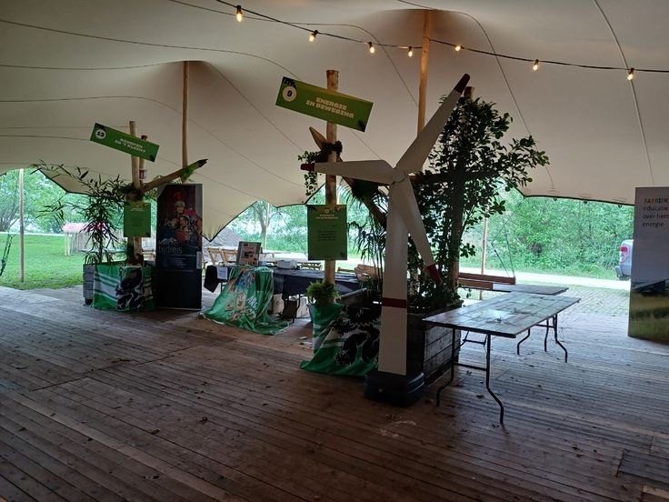 Energy zone under the stretch tent, with wind turbine and planting