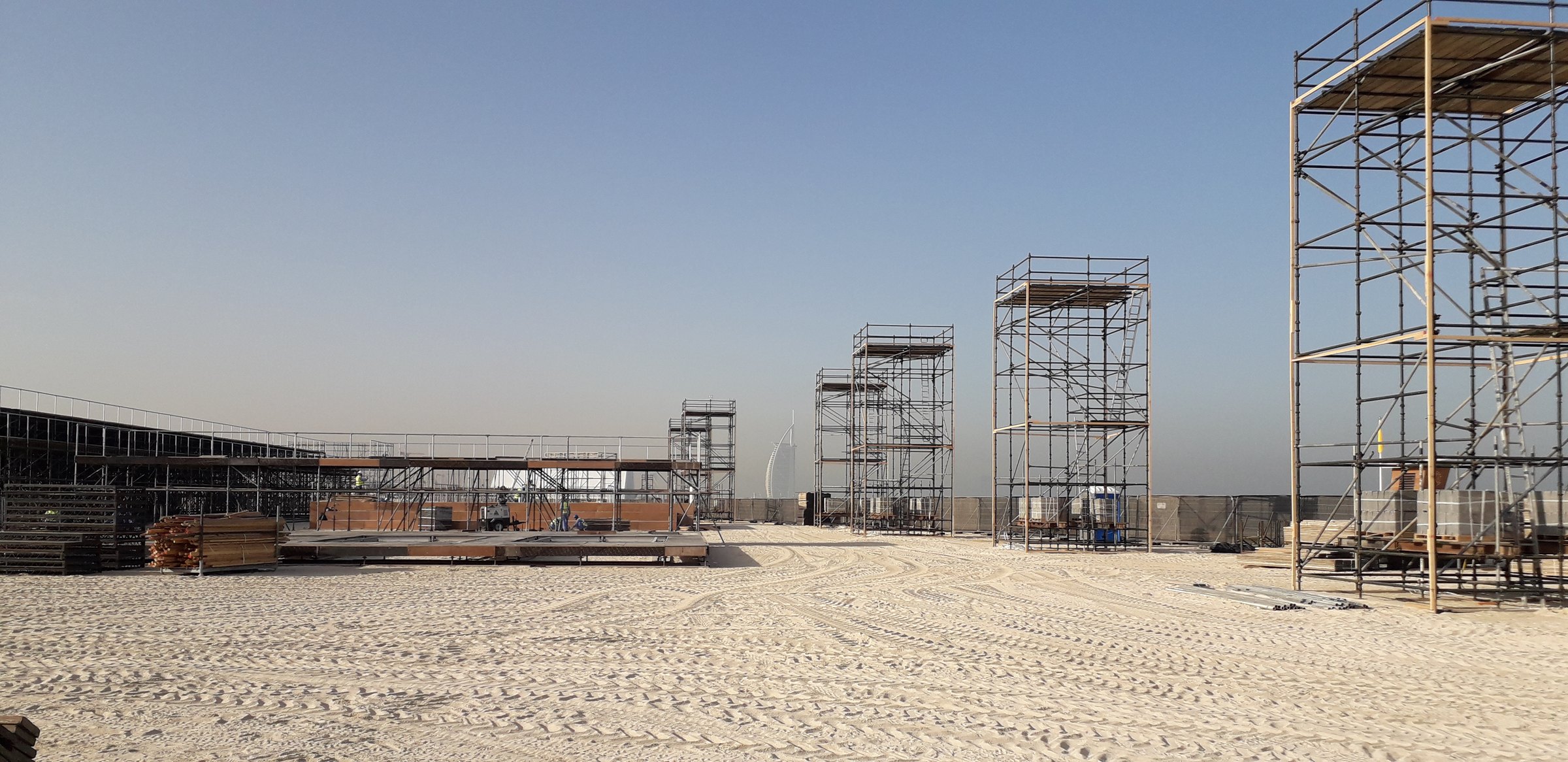 Scaffold towers and grandstand on the beach in Dubai