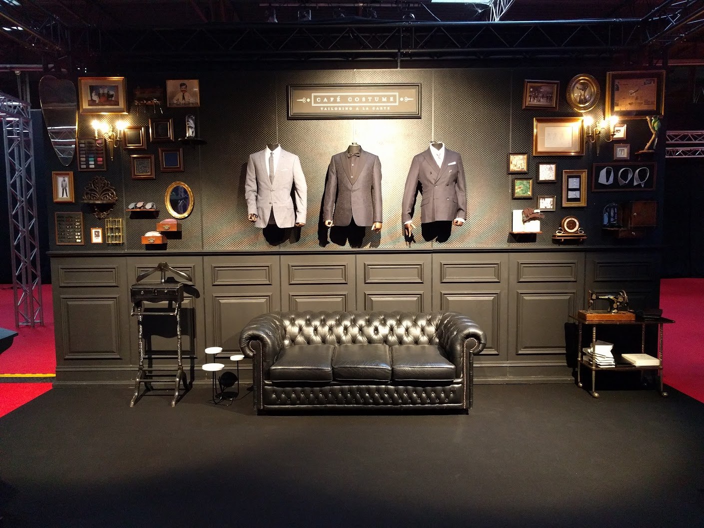 The Café Costume stand with chesterfield and wall collection