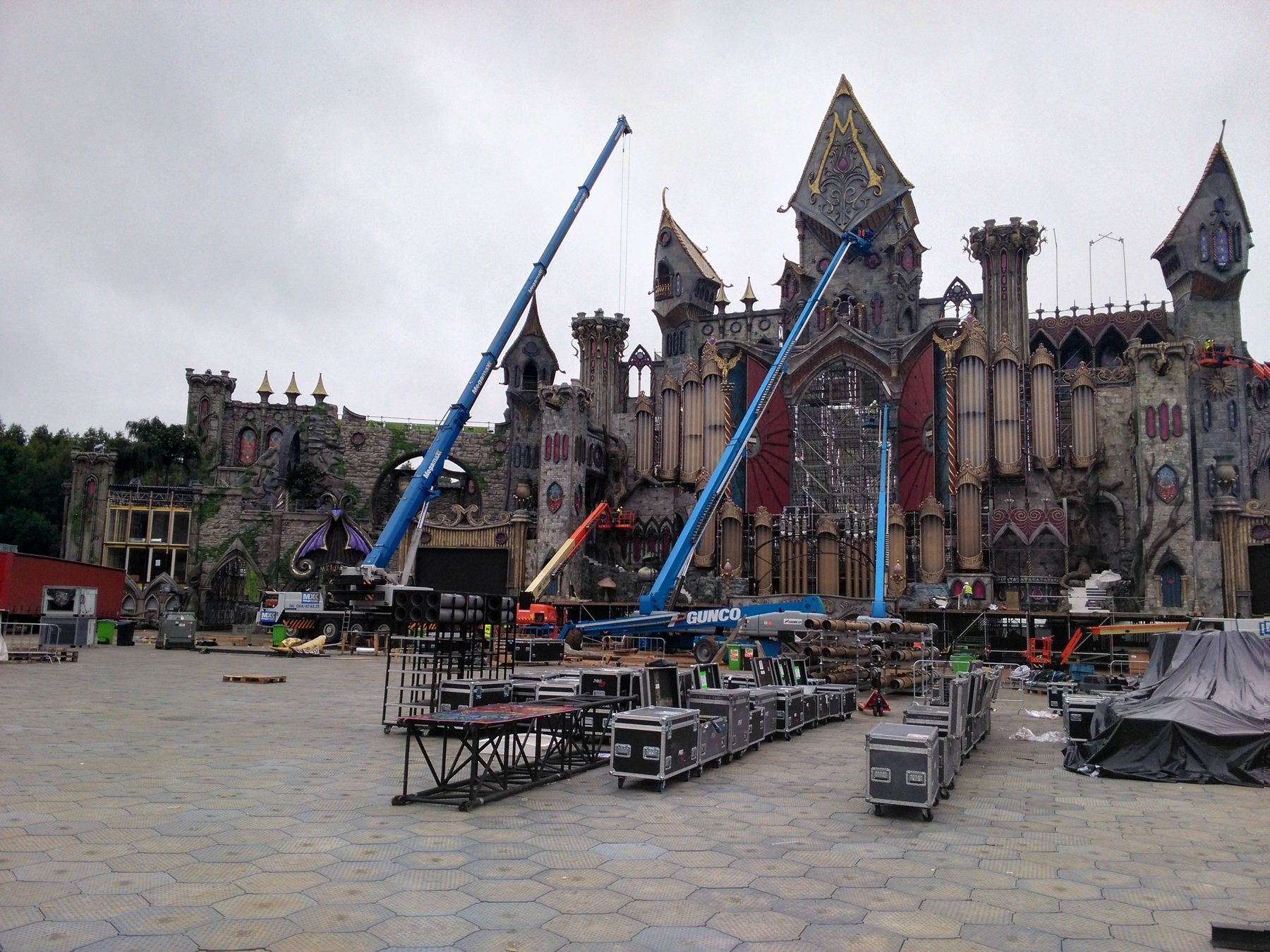The mainstage under construction, with two cranes at work